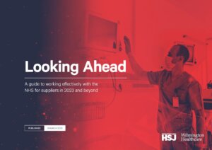 Cover of our white paper Looking Ahead 2023 showing a healthcare worker adjusting a monitor